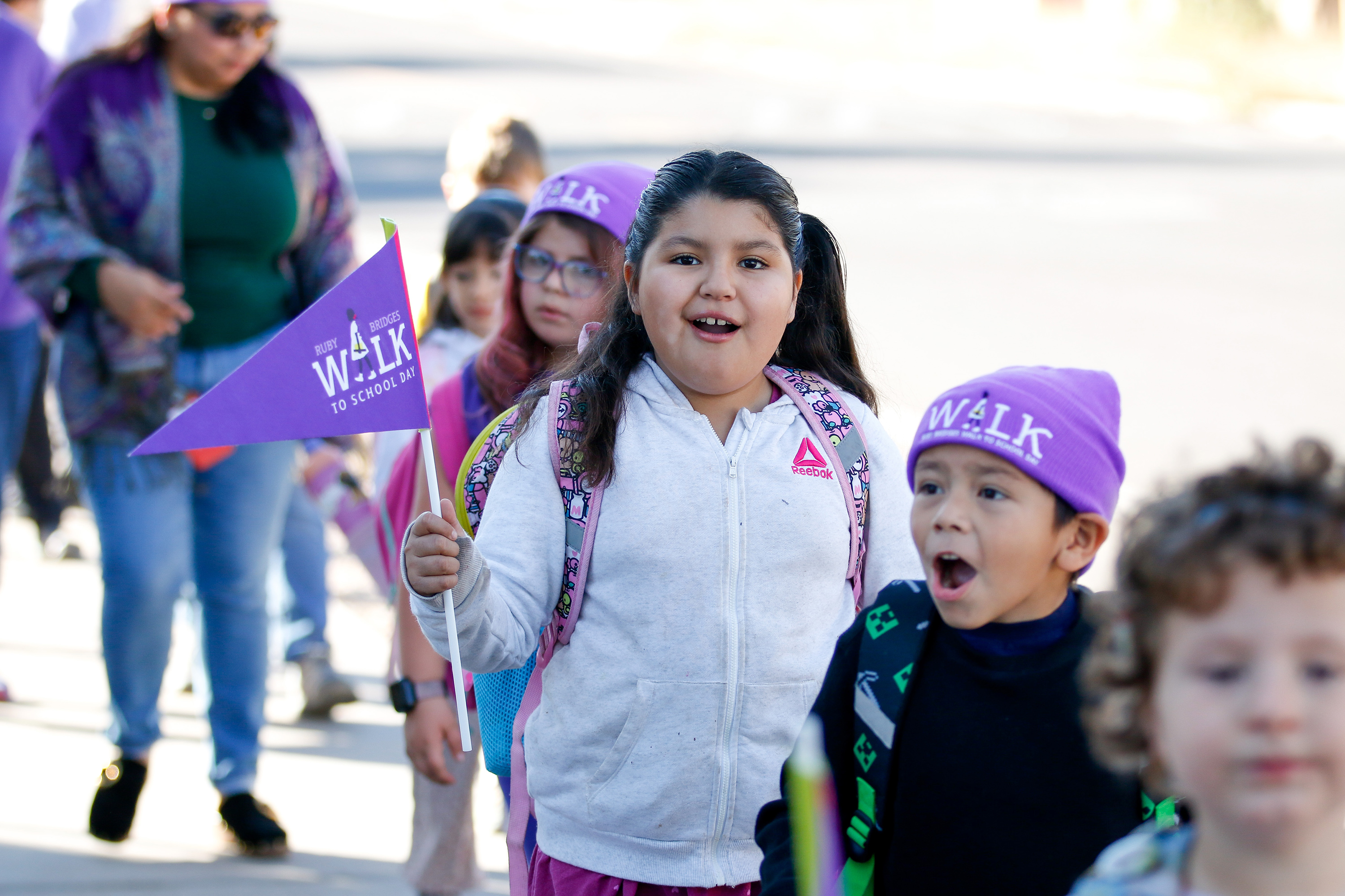 A little girl and boy show off their excitement to participate in the Ruby Bridges Walk